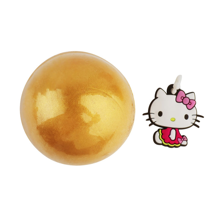 Goldene Take Care Badebombe mit Hello Kitty Überraschungs-Anhänger
